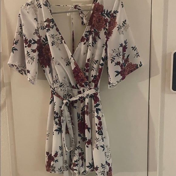 Floral Wrap Shorts Romper with Belt by Charlotte Russe. - Picture 2 of 7